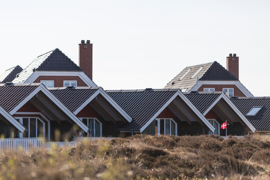 Denmark, Romo, Clear sky over row of summer houses