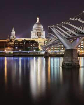 UK, England, London, Millennium Bridge at night with illuminated Saint Pauls Cathedral in background