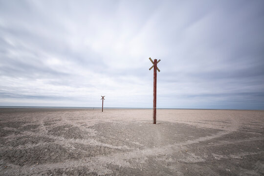 Denmark, Romo, Markers along coastal beach