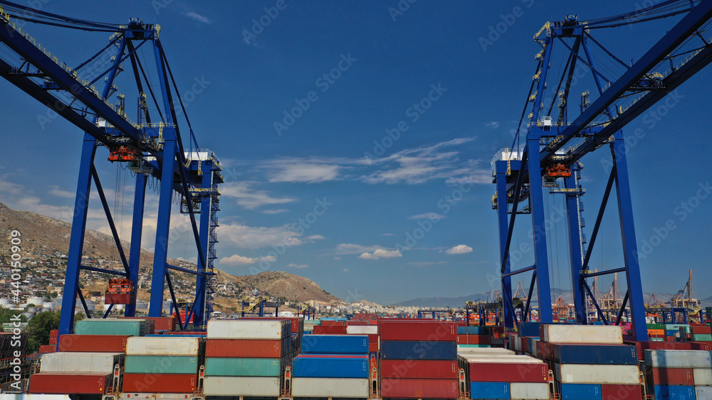 Wall mural aerial drone closeup photo of colourful container seaside port and logistics terminal of perama in c