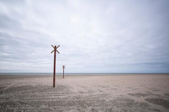 Denmark, Romo, Markers along coastal beach
