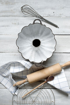Baking utensils against rustic wooden background