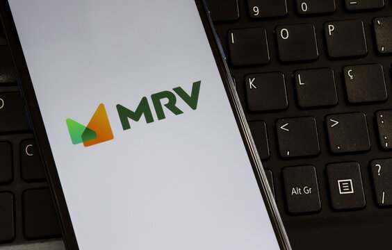 Bahia, Brazil - May 1st, 2025: MRV logo on smartphone screen. MRV Engenharia e Participa&ccedil;&otilde;es is a Brazilian company homebuilder and real estate developer. 