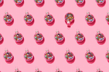 Bright balls for Christmas tree pattern on pink background