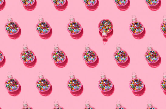Bright balls for Christmas tree pattern on pink background
