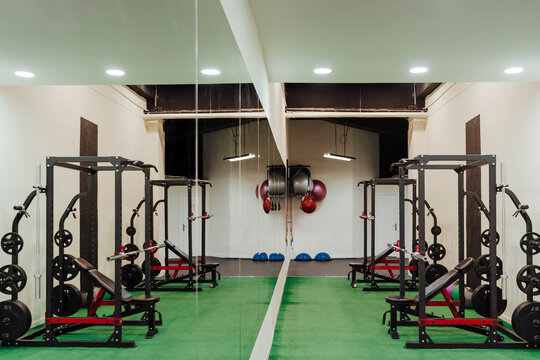 Exercise machine by mirror in health club