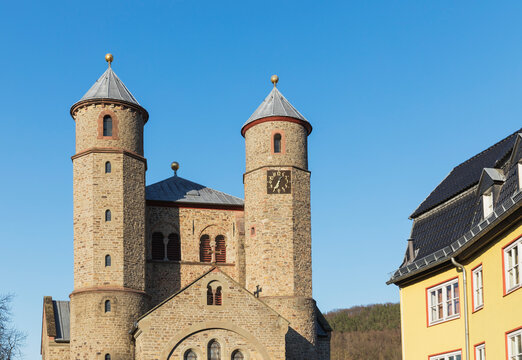 Germany, North Rhine Westphalia, Bad Munstereifel, Facade of basilica under blue sky