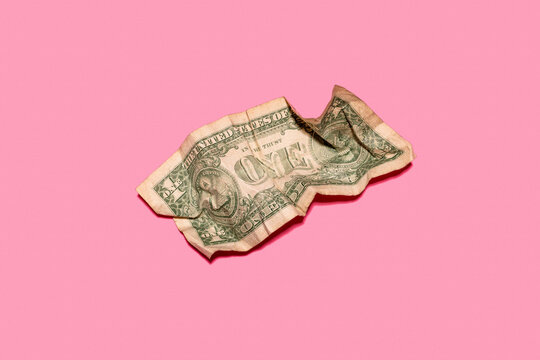 Studio shot of single crumpled one dollar bill
