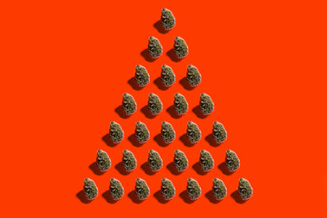 Studio shot of arrangement of trees standing against red background