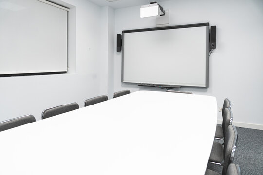 Empty illuminated board room in coworking office