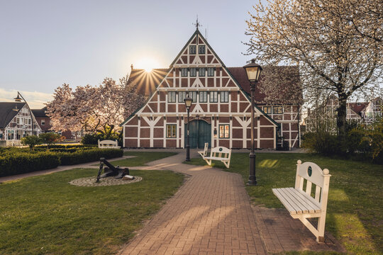 Germany, Altes Land, Jork, Jork town hall in spring at sunset