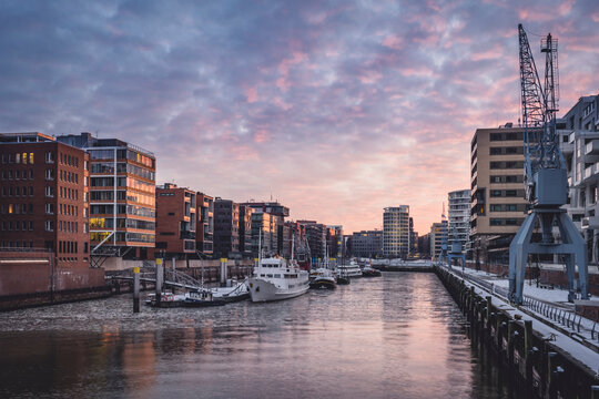 Germany, Hamburg, Sandtorhafen at sunset e in winter