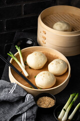 Chinese steamed buns baozi with steamer