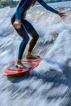 Low section of woman wakesurfing in Moskva river
