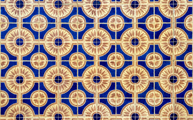 Full frame of blue and yellow colored mosaic wall with square tiles