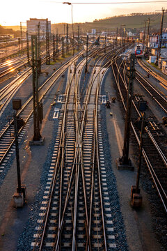 Germany, Bavaria, Wurzburg, Empty railroad tracks at sunset