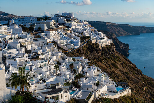 Greece, Santorini, Fira, White-washed houses of town situated at edge of coastal caldera
