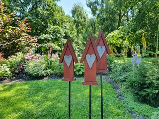 Wooden houses in the garden.  Red houses are installed in the garden as decorations.