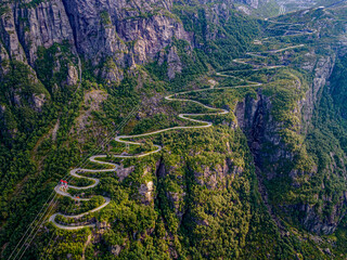 Norway, Rogaland, Lysebotn, Aerial view of cable cars and road winding along steep cliff