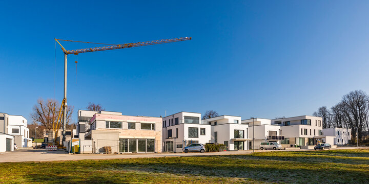 Germany, Baden-Wurttemberg, Ludwigsburg, Panorama of clear sky over new modern development area with industrial crane in background