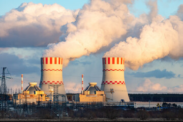 Cooling towers of Nuclear power plant emissions of steam in the air atmosphere. Industrial zone...