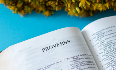 Naklejka na ściany i meble Proverbs Book from the Christian Holy Bible inspired by God and Jesus Christ. Wise sayings written by king Solomon. Biblical wisdom concept.