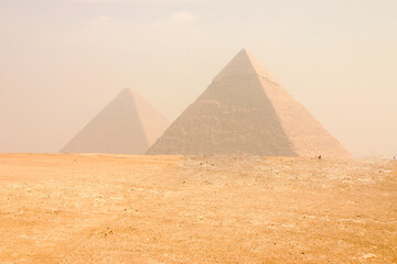 View of the Great Pyramids of Giza in Cairo Egypt on a hazing morning 