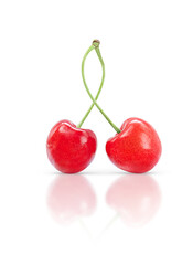 Pair of sweet cherries isolated on white background with shadow and reflection.
