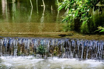 River waterfall in the summer Park