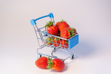 Red strawberries in a grocery cart.