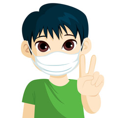 Cute little asian boy wearing medical face mask making victory sign hand gesture