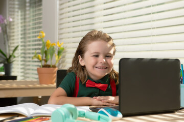 Child schoolboy pupil learn english online at home school. Homeschooling and distance education for kids.