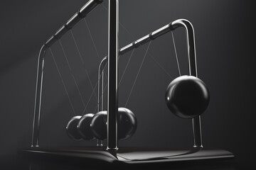Newton's cradle in action. Demonstration of the law of conservation of energy
