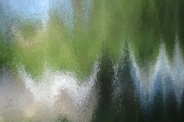 painting-like outdoor world through glass door