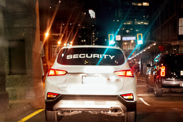 Closeup shot of a security company car operating to patrolÂ the city