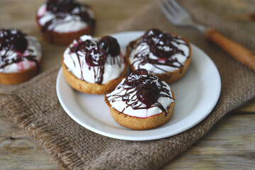 Cottage cheese tartlets with cherries and chocolate. Healthy dessert. The keto diet.
