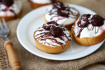 Cottage cheese tartlets with cherries and chocolate. Healthy dessert. The keto diet.