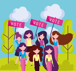 women hold placards vote