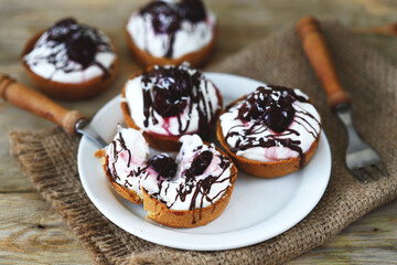 Cottage cheese tartlets with cherries and chocolate. Healthy dessert. The keto diet.
