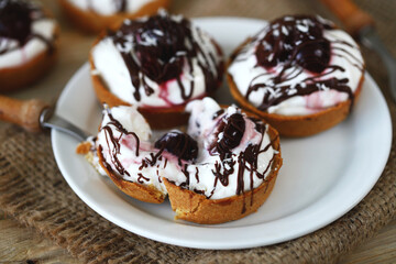 Cottage cheese tartlets with cherries and chocolate. Healthy dessert. The keto diet.