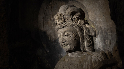 Fototapeta na wymiar Buddha's face carved in the rock