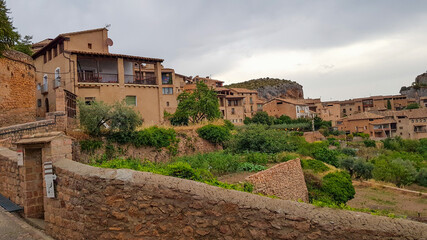 Fototapeta na wymiar Alkézar fachadas de piedra típicas de la arquitectura de esa población.