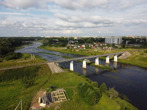 railway bridge over the Luga river in the city of Kingisepp Leningrad region Russia aerial photo in a summer day