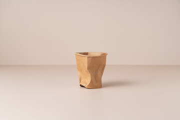 Disposable paper cups on a beige background. A zero-waste concept.