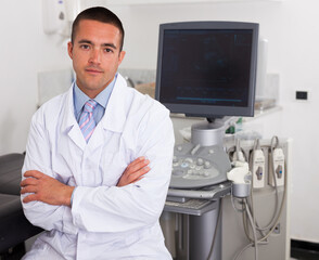 Portrait of young man hospital doctor in cabinet of ultrasound test