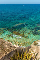 rocky beach with blue water