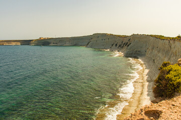 rocky beach with blue water