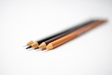 Obraz premium Colored Pencils on White Backdrop