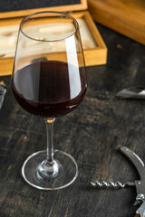 WINE GLASS ON A RUSTIC TABLE