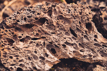 Close up detail of volcanic lava rock basalt found in the desert